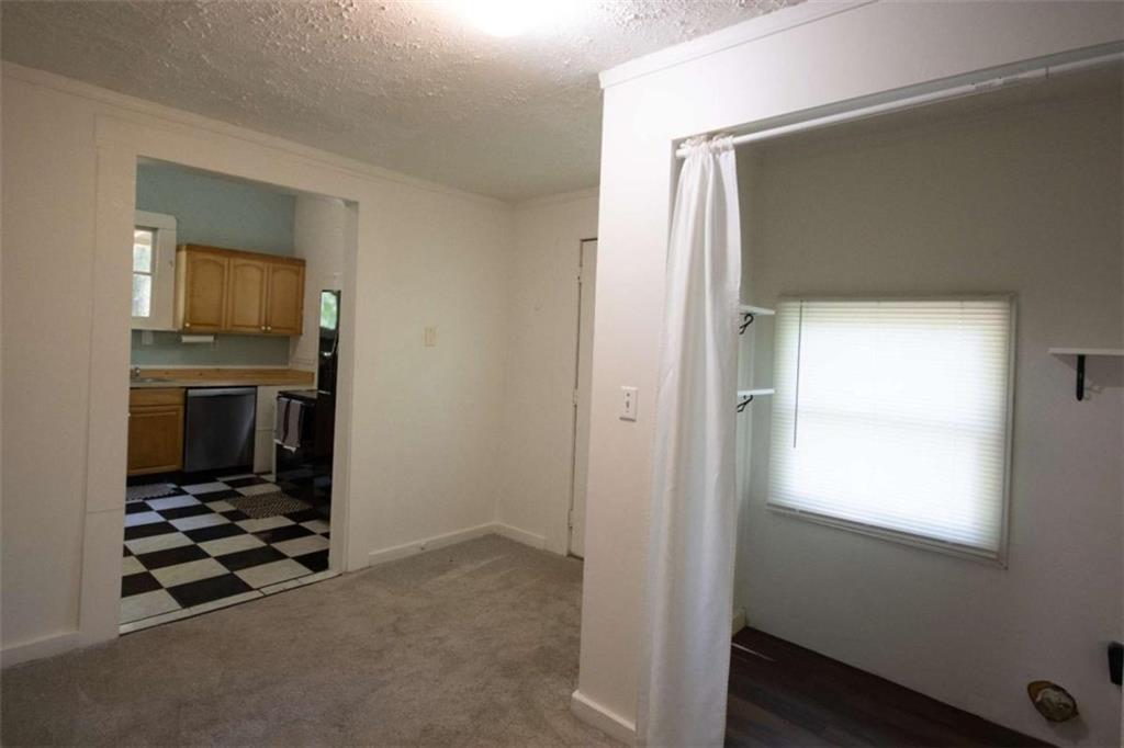 285 East Main Street Forsyth, GA 31029 - Photo 9 of 27 a room with window and a fireplace