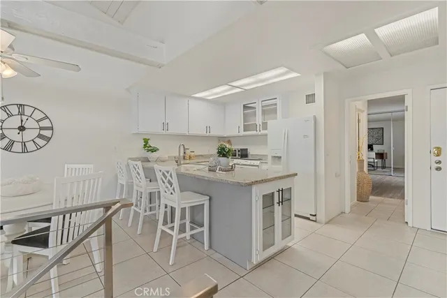 a kitchen with a sink cabinets and window