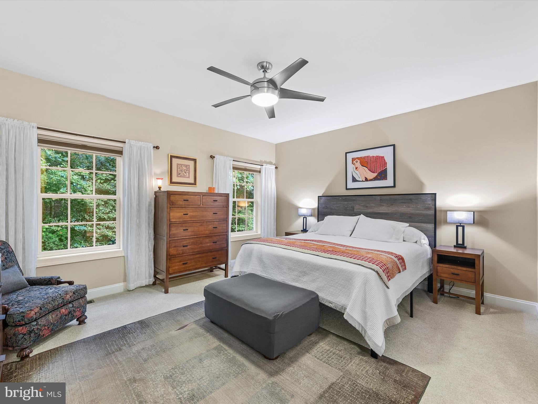 303 Valley Road Milton, DE 19968 - Photo 16 of 72 a bedroom with a bed couches and windows