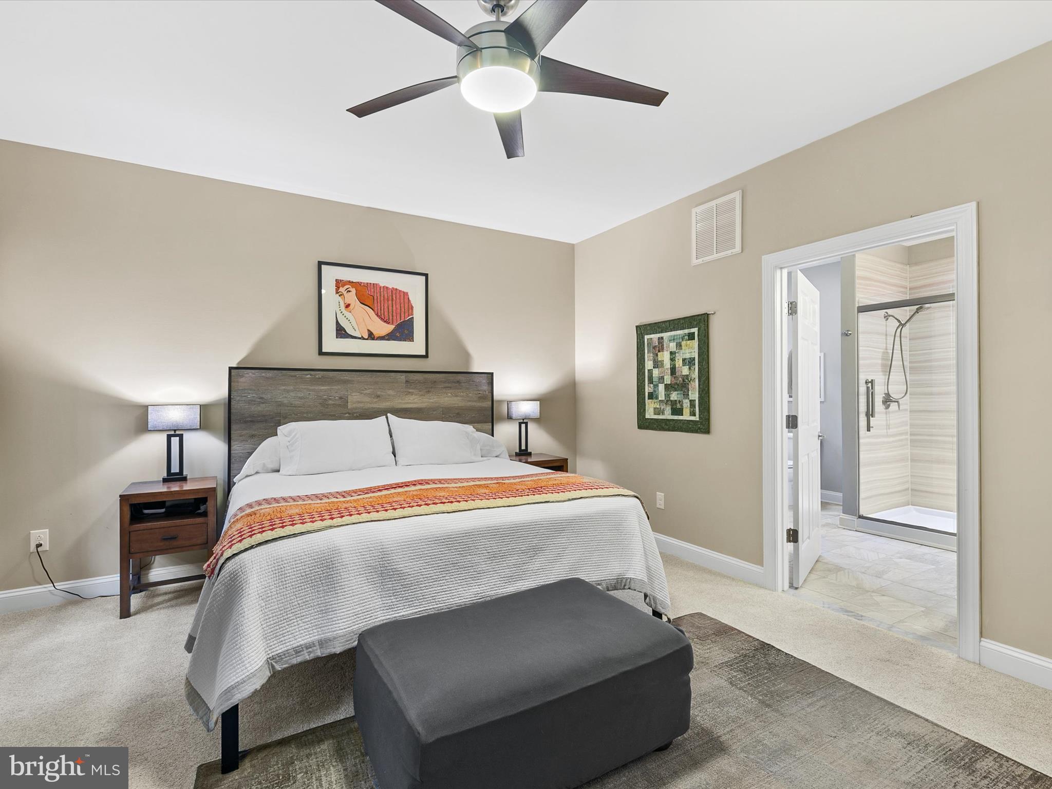 303 Valley Road Milton, DE 19968 - Photo 17 of 72 a bedroom with a bed and a chandelier