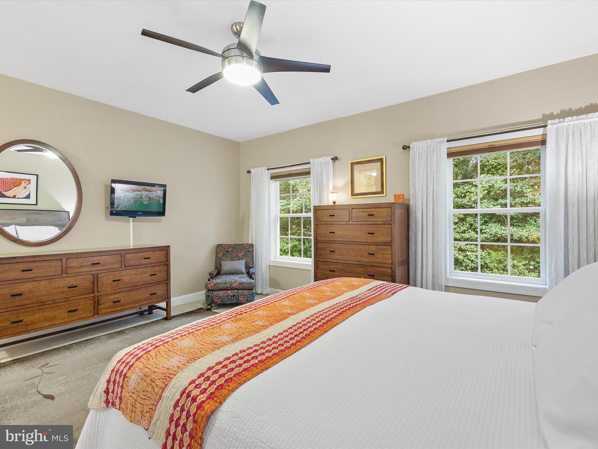303 Valley Road Milton, DE 19968 - Photo 19 of 72 a bedroom with a bed and a dresser