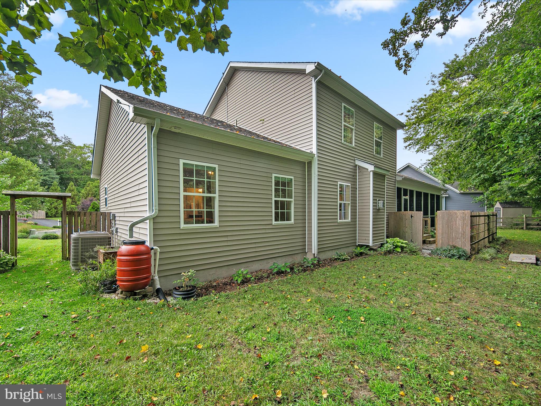 303 Valley Road Milton, DE 19968 - Photo 34 of 72 a front view of a house with a garden