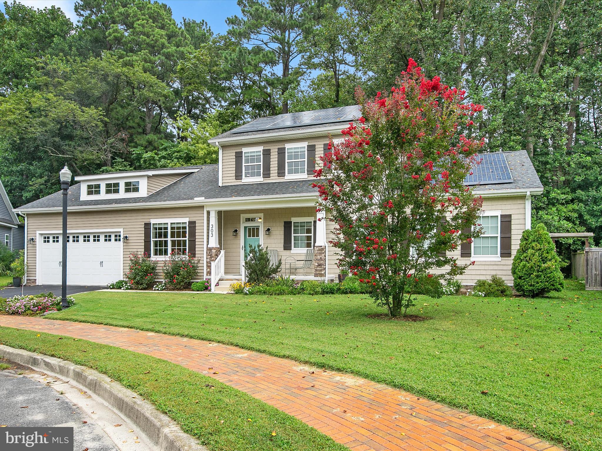 303 Valley Road Milton, DE 19968 - Photo 35 of 72 a front view of a house with a yard and trees
