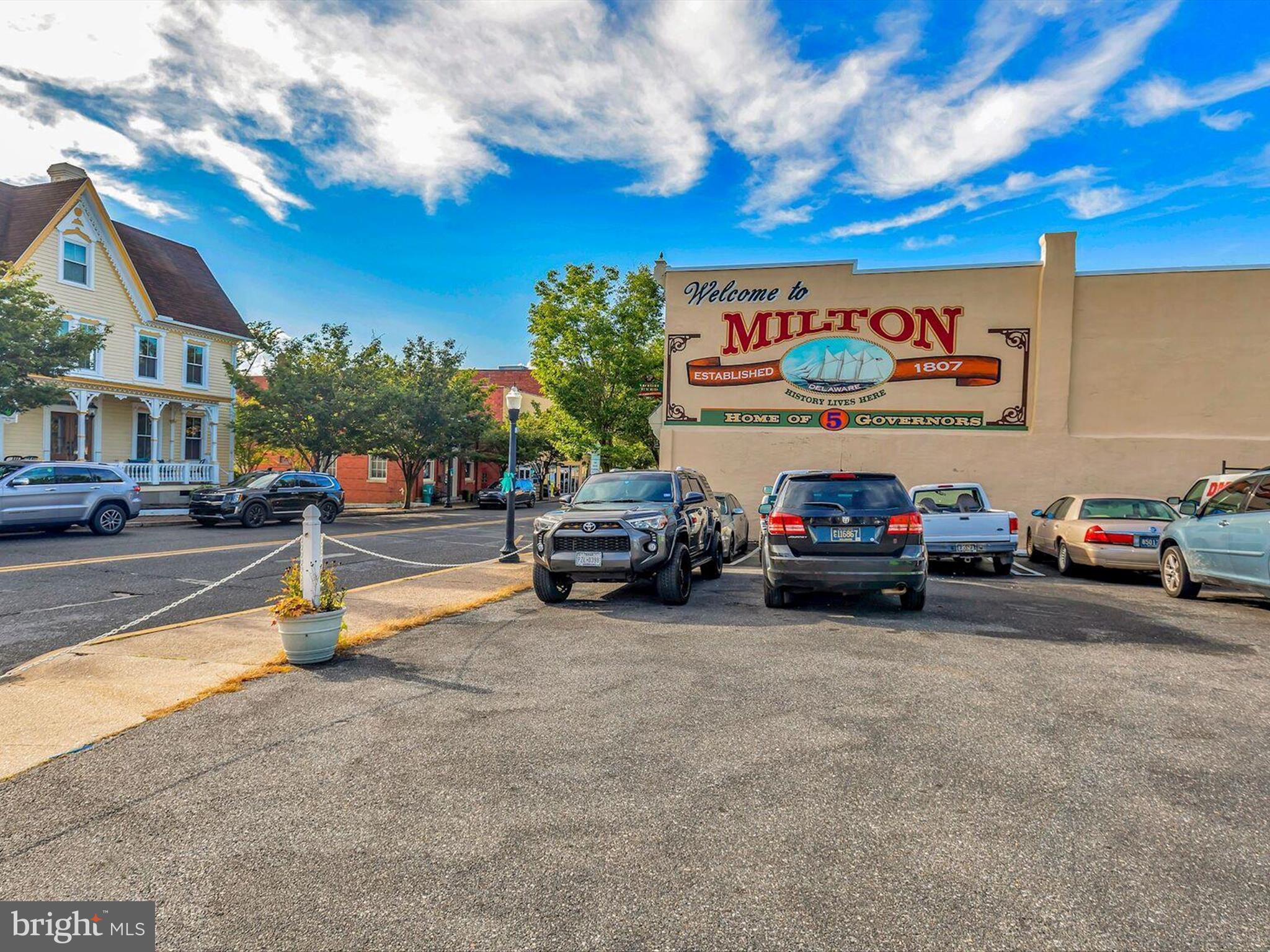 303 Valley Road Milton, DE 19968 - Photo 37 of 72 a view of a cars park in front of a building