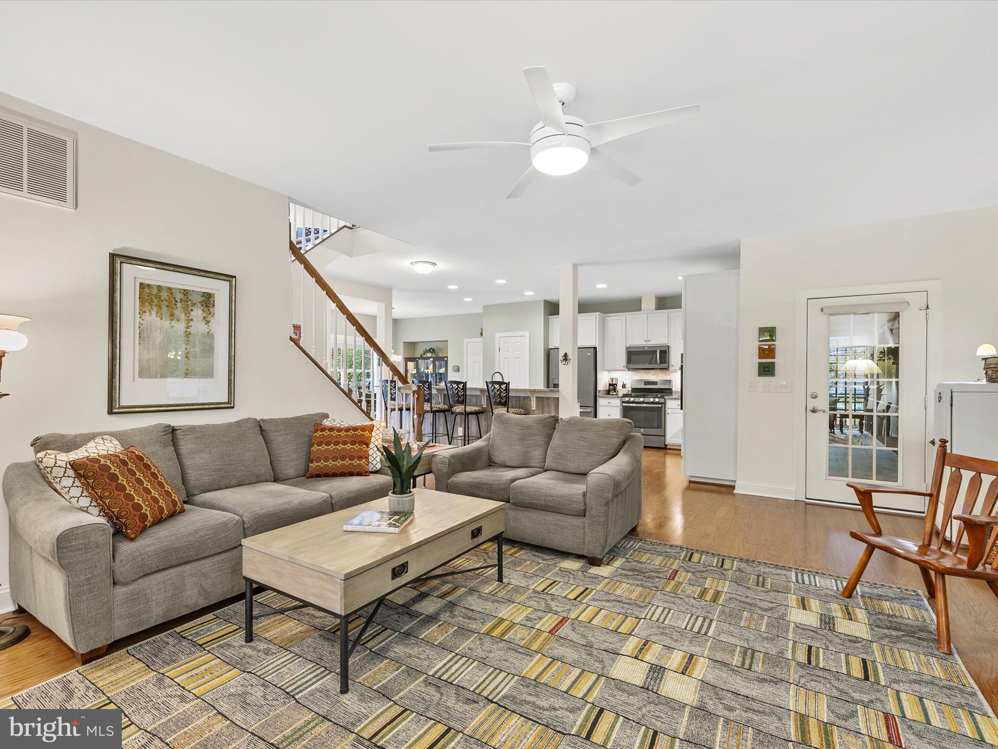 303 Valley Road Milton, DE 19968 - Photo 6 of 72 a living room with furniture and a dining table with rug