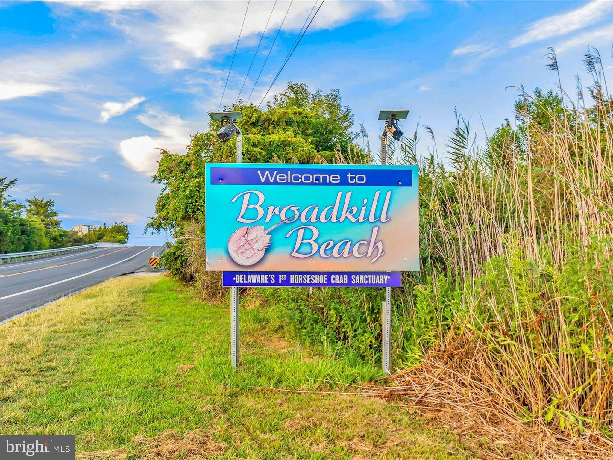 303 Valley Road Milton, DE 19968 - Photo 65 of 72 a sign that is on the side of the road