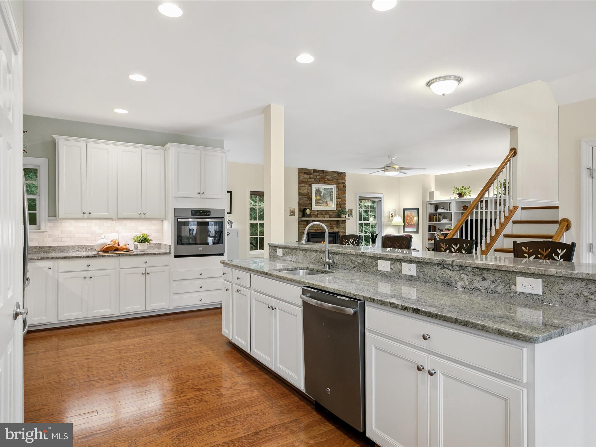 303 Valley Road Milton, DE 19968 - Photo 9 of 72 a kitchen with stainless steel appliances granite countertop a sink counter space and cabinets