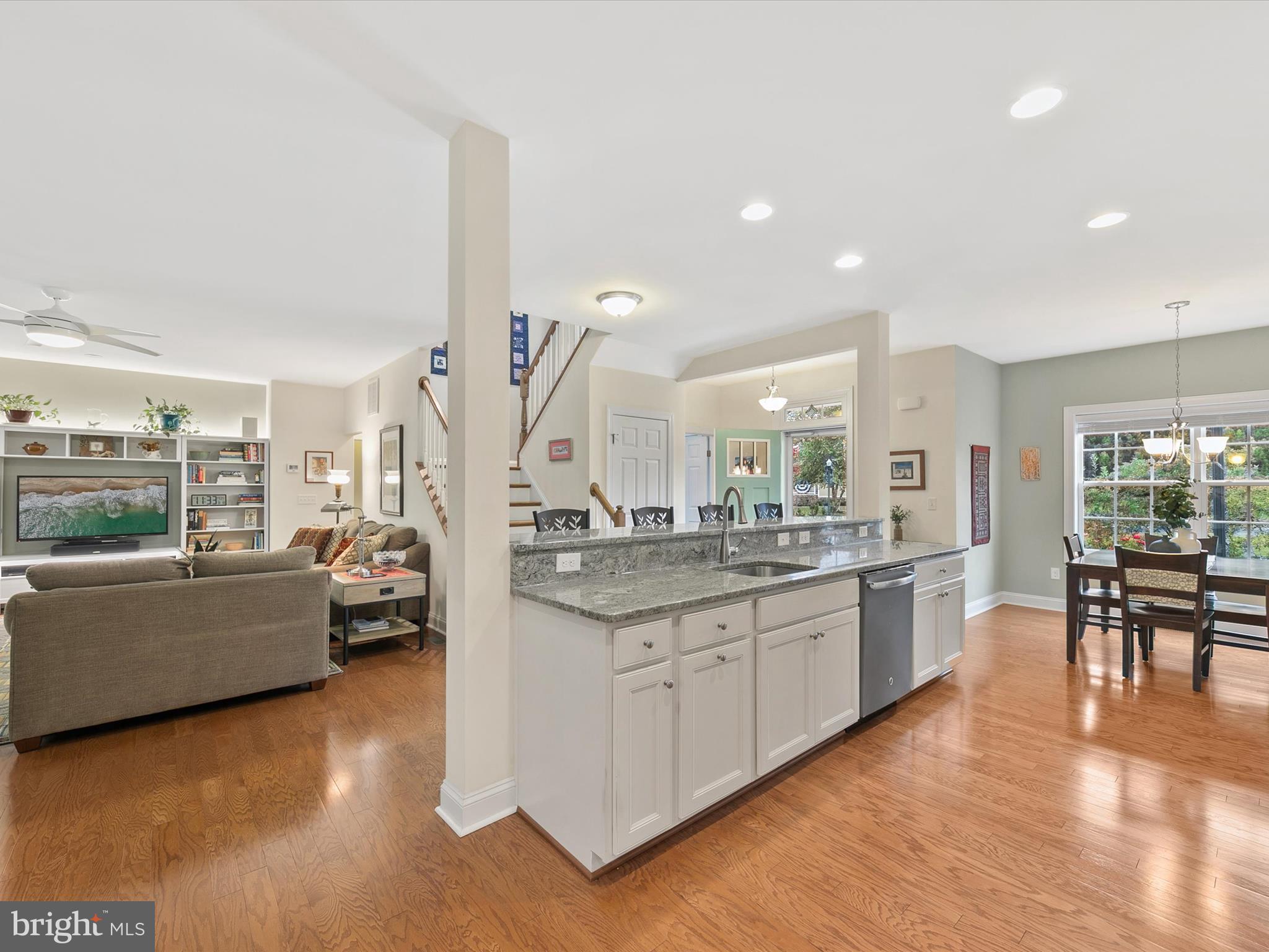 303 Valley Road Milton, DE 19968 - Photo 10 of 72 a kitchen with lots of counter top space and living room