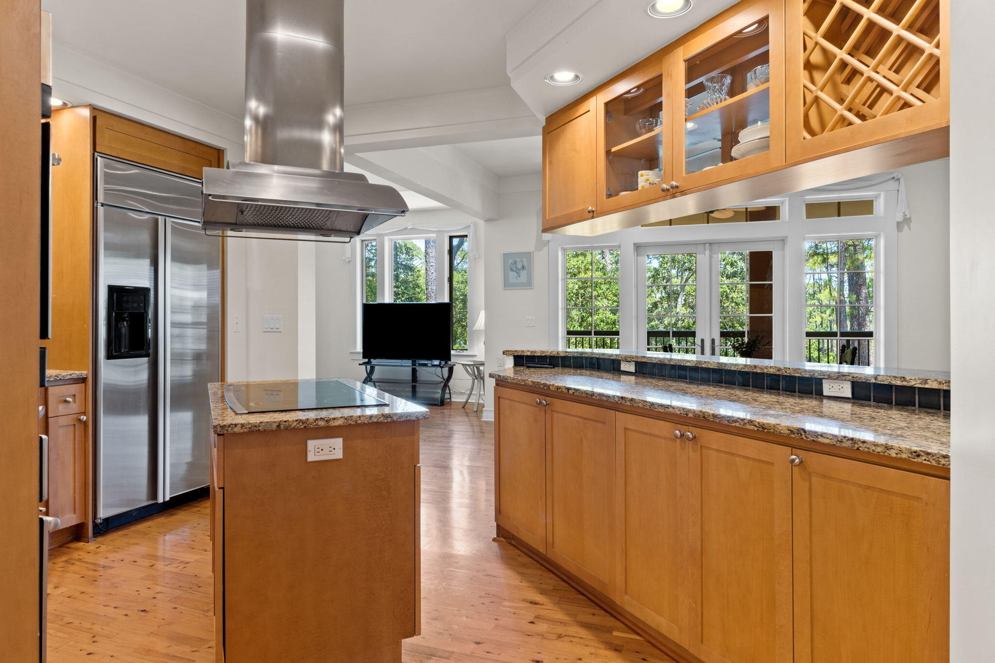1112 Prospect Promenade, Unit 201 Panama City Beach, FL 32413 - Photo 16 of 43 a kitchen with stainless steel appliances granite countertop a refrigerator and a sink