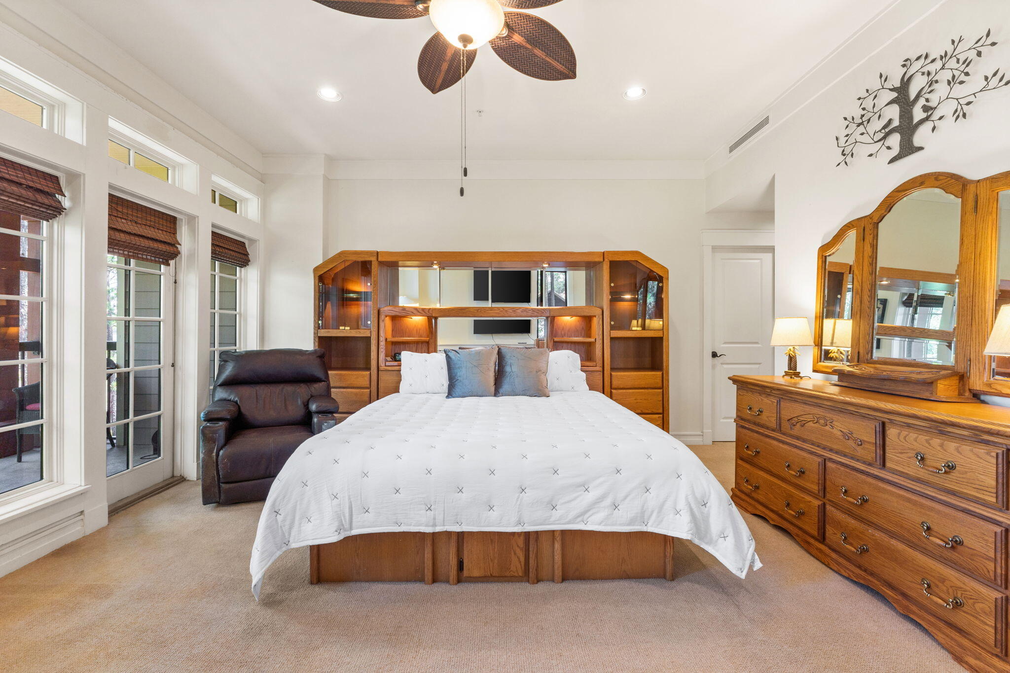 1112 Prospect Promenade, Unit 201 Panama City Beach, FL 32413 - Photo 18 of 43 a bedroom with a large bed and wooden floor