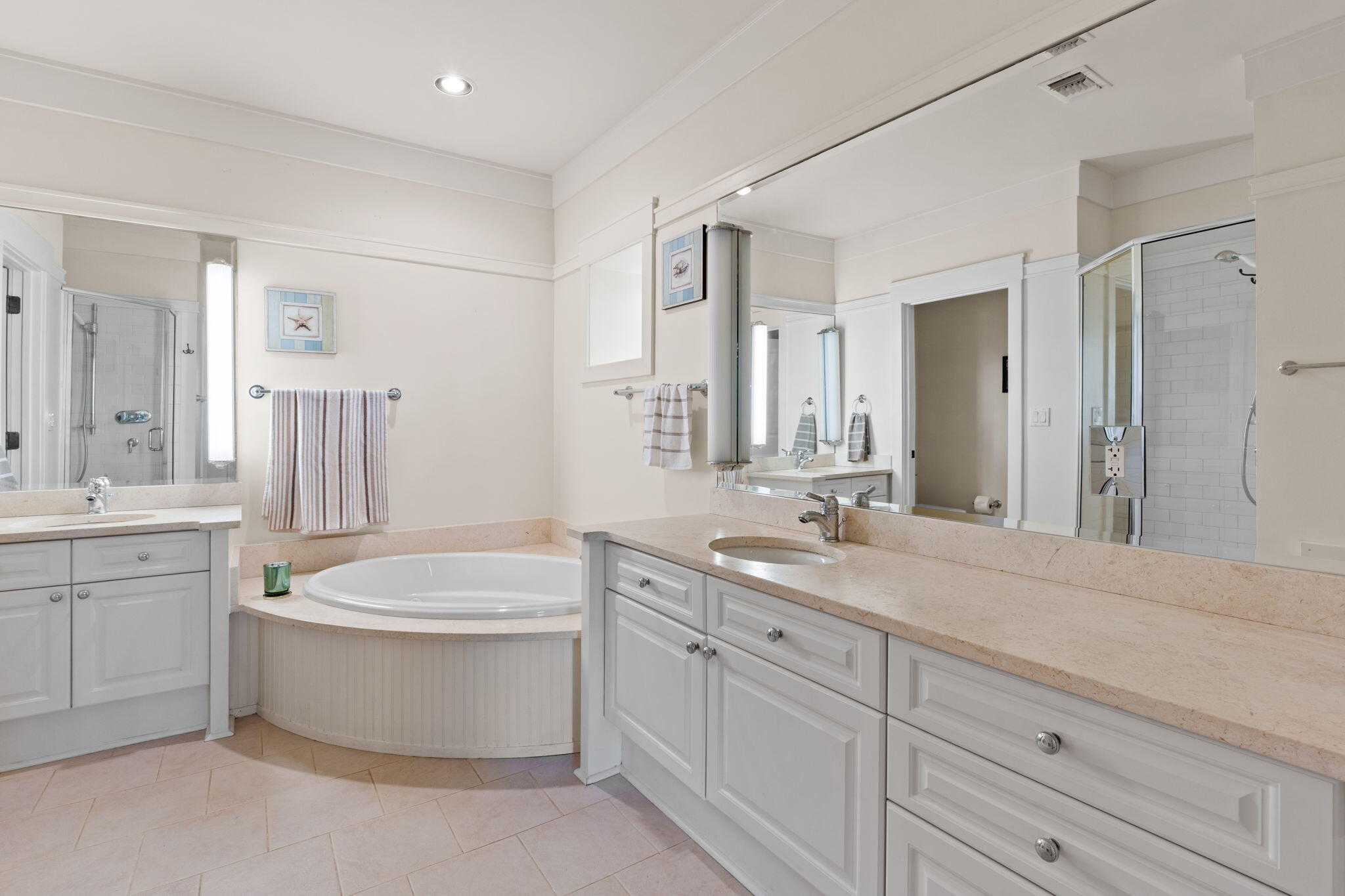 1112 Prospect Promenade, Unit 201 Panama City Beach, FL 32413 - Photo 22 of 43 a spacious bathroom with a granite countertop sink mirror and bathtub