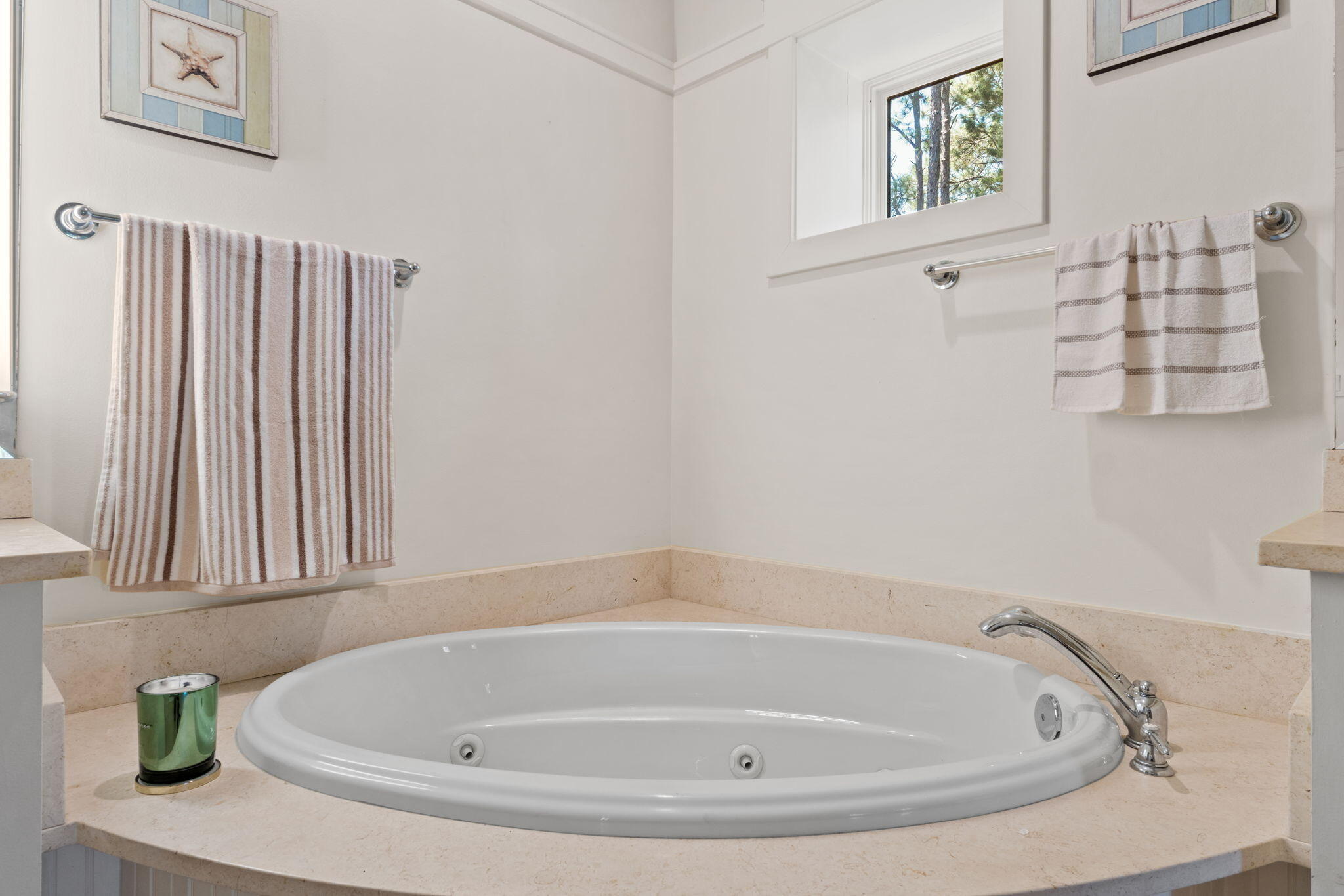 1112 Prospect Promenade, Unit 201 Panama City Beach, FL 32413 - Photo 25 of 43 a bathroom with bathtub and window