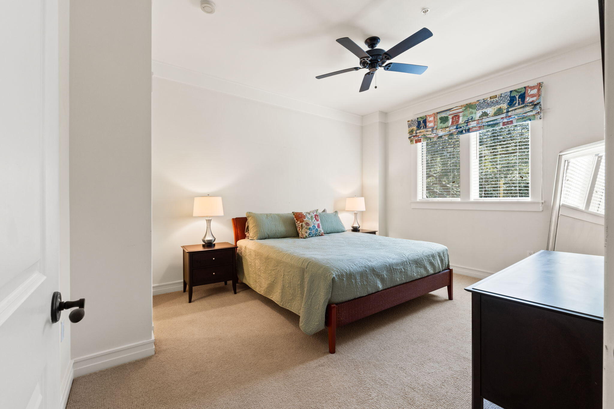 1112 Prospect Promenade, Unit 201 Panama City Beach, FL 32413 - Photo 28 of 43 a bedroom with a bed and window