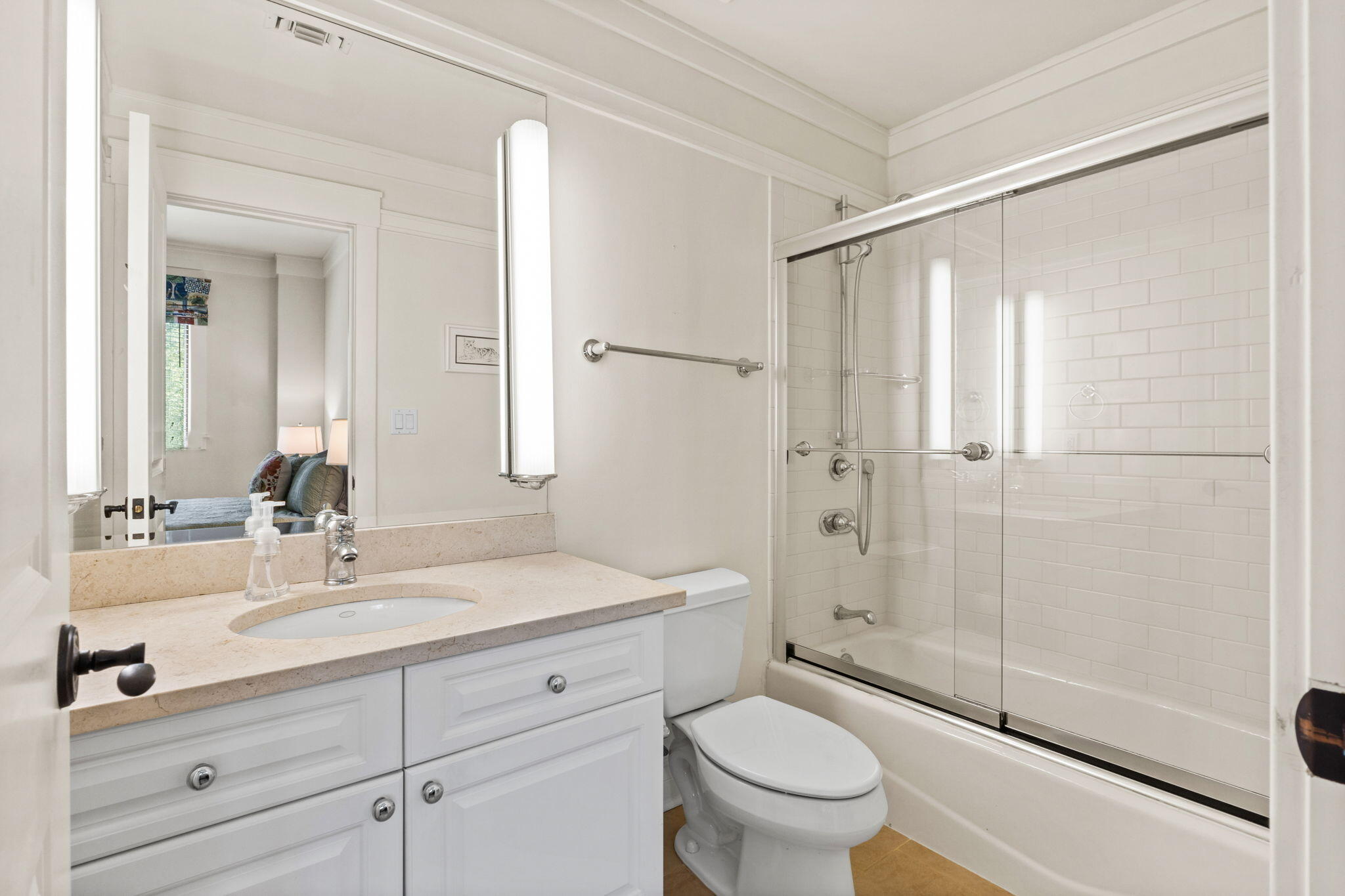 1112 Prospect Promenade, Unit 201 Panama City Beach, FL 32413 - Photo 29 of 43 a bathroom with a granite countertop sink a toilet and shower