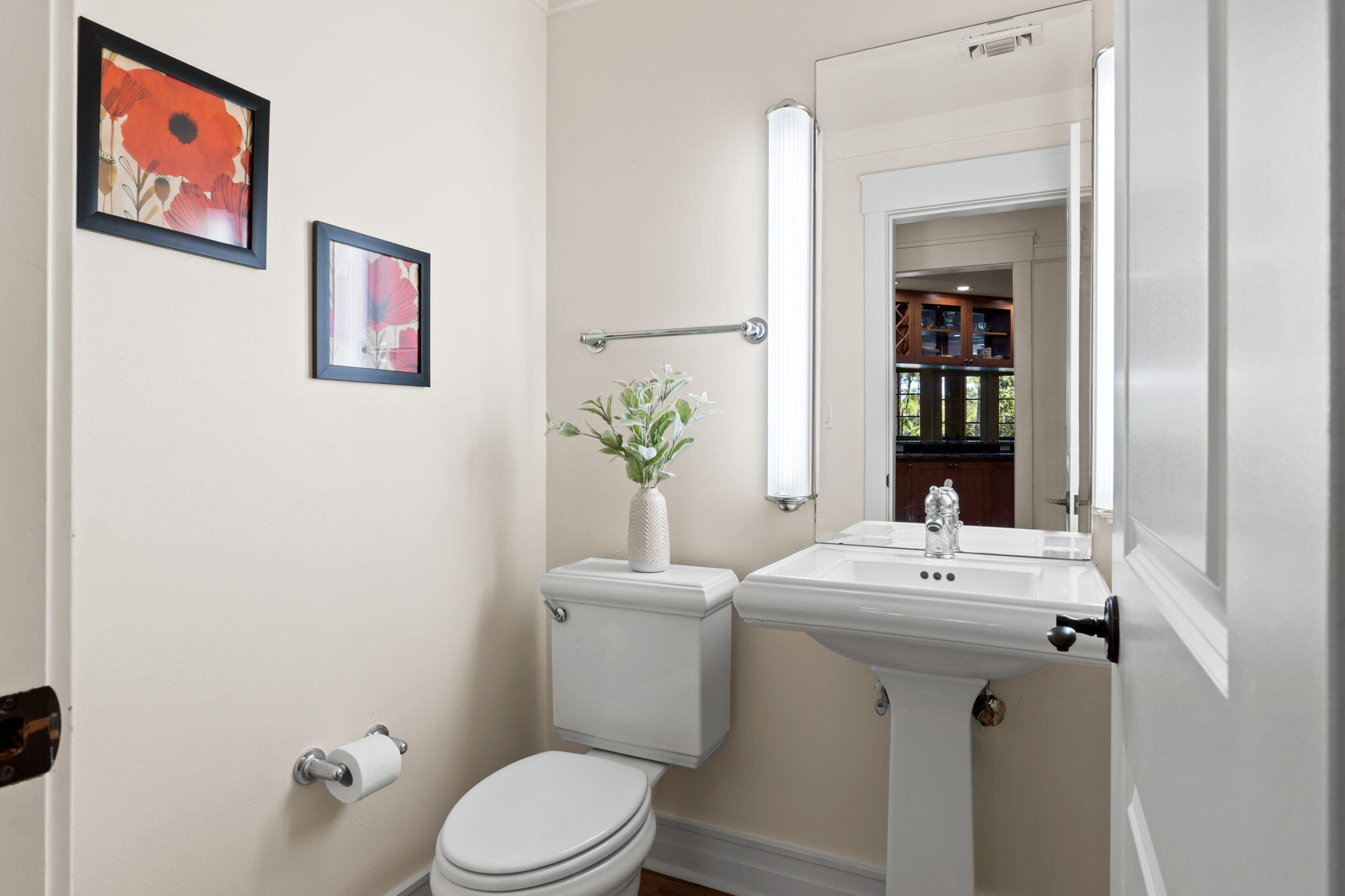 1112 Prospect Promenade, Unit 201 Panama City Beach, FL 32413 - Photo 33 of 43 a bathroom with a sink mirror and toilet