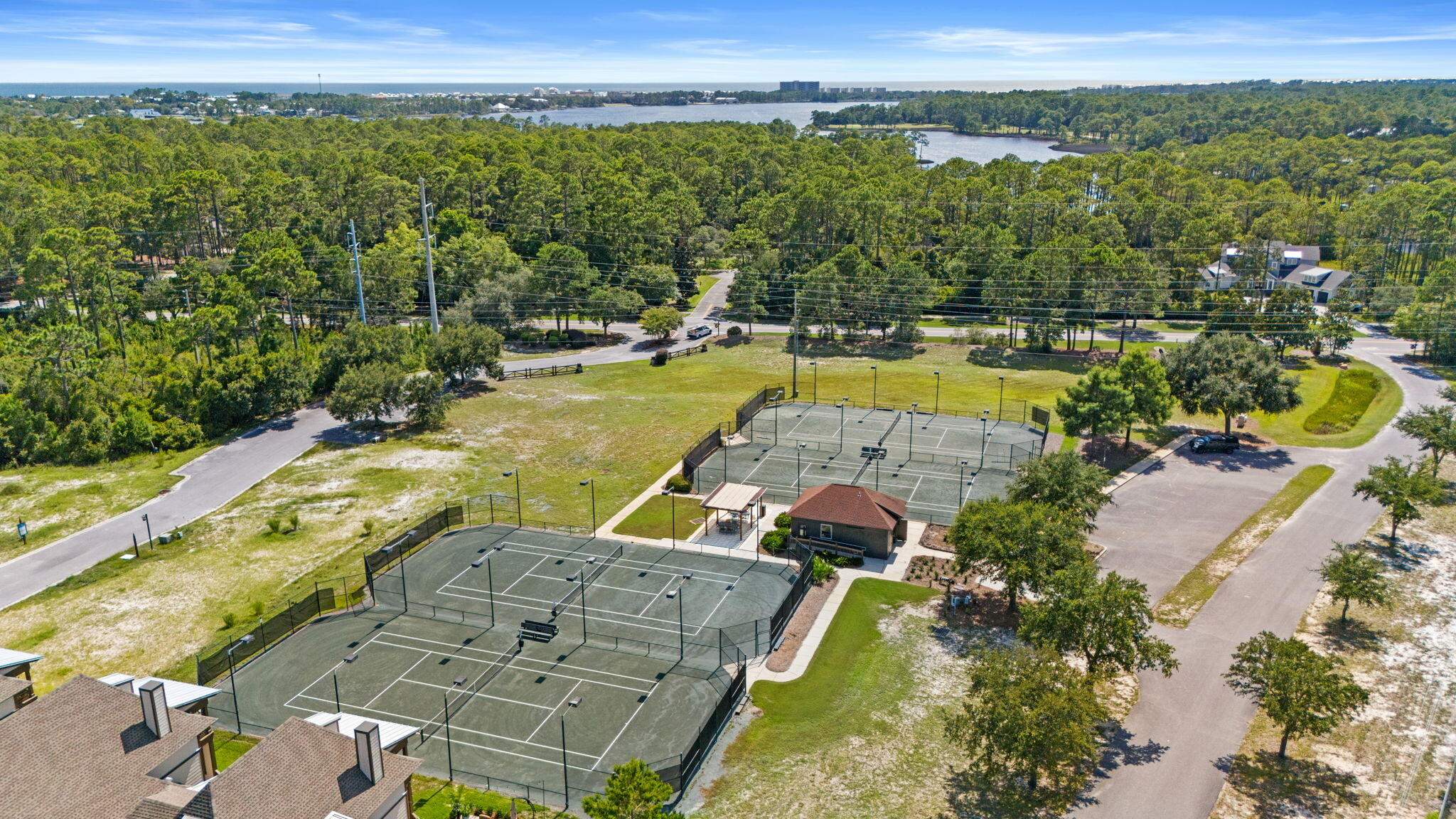 1112 Prospect Promenade, Unit 201 Panama City Beach, FL 32413 - Photo 36 of 43 a view of swimming pool with a garden