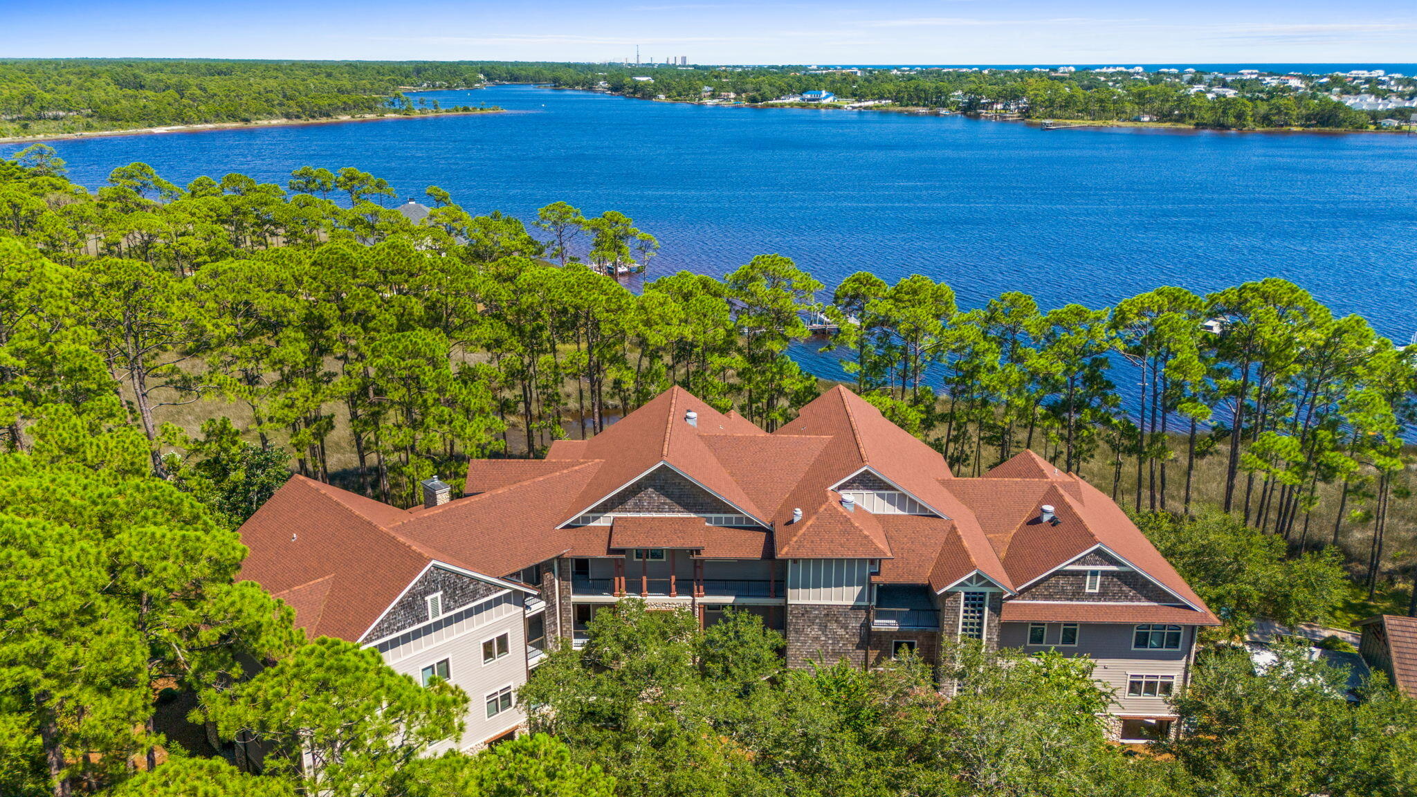 1112 Prospect Promenade, Unit 201 Panama City Beach, FL 32413 - Photo 37 of 43 an aerial view of a house with a lake view