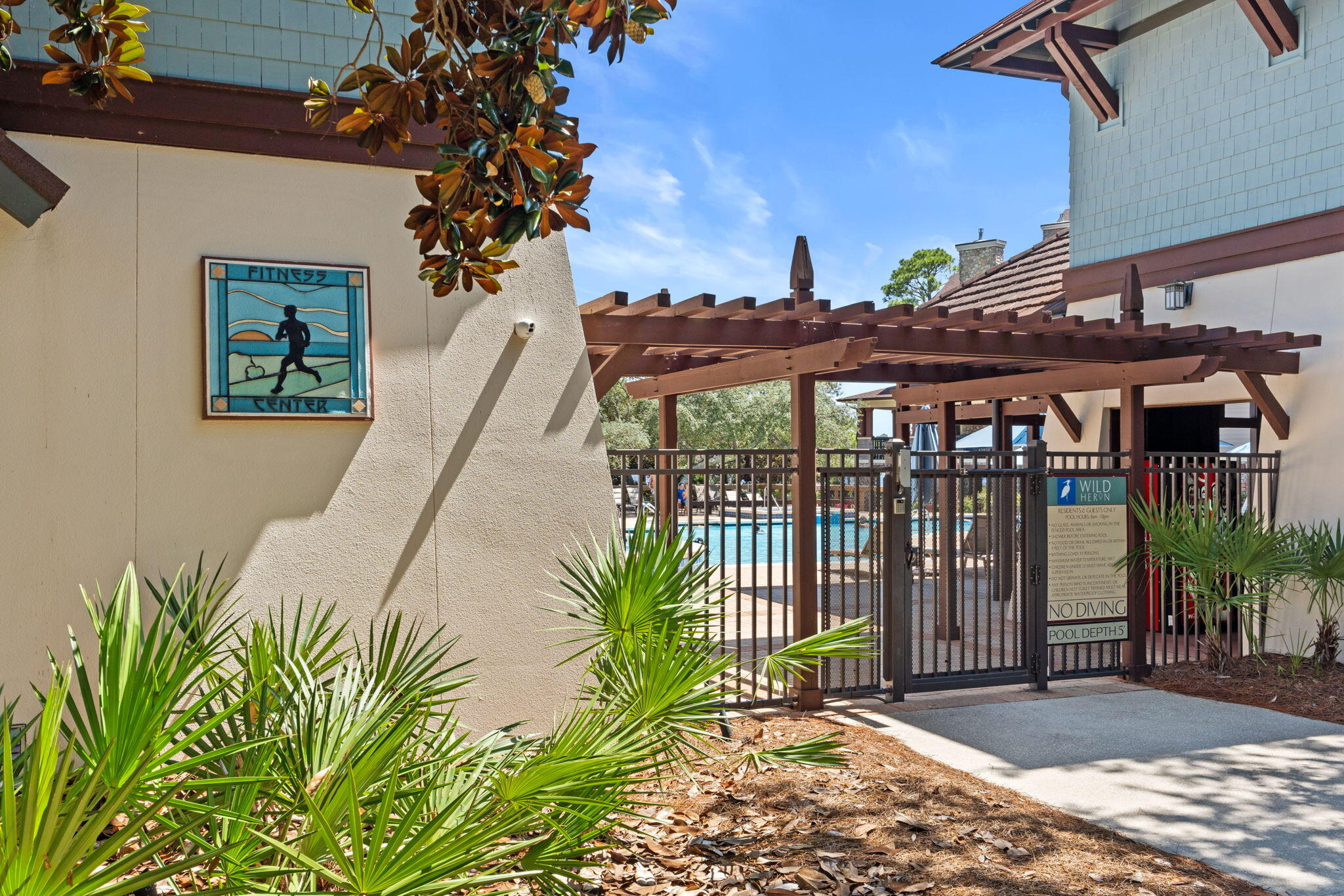 1112 Prospect Promenade, Unit 201 Panama City Beach, FL 32413 - Photo 38 of 43 a view of a patio with a table and chairs