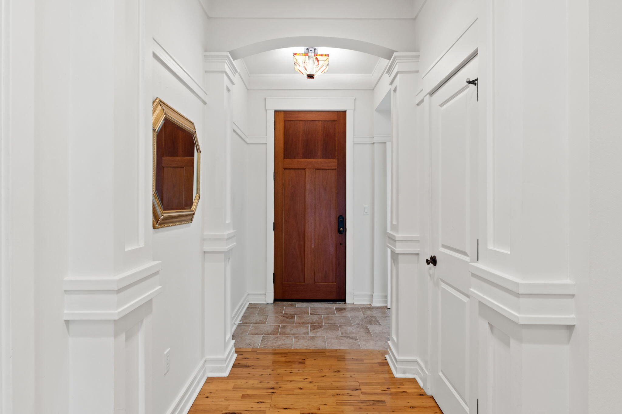 1112 Prospect Promenade, Unit 201 Panama City Beach, FL 32413 - Photo 4 of 43 a view of a hallway with wooden floor and closet area