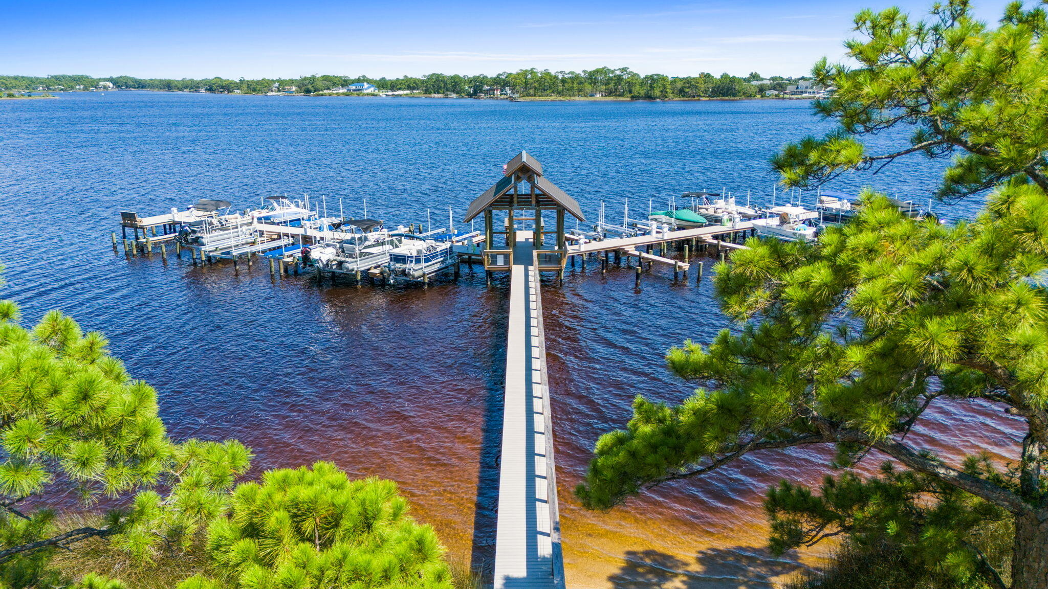 1112 Prospect Promenade, Unit 201 Panama City Beach, FL 32413 - Photo 41 of 43 a view of a terrace with lawn chairs next to a yard