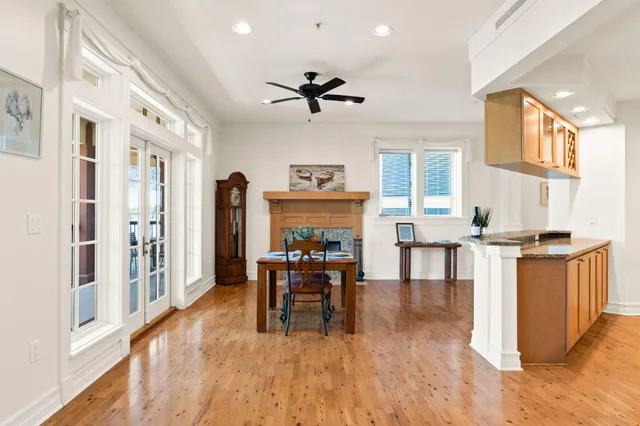 a living room with fireplace furniture and a wooden floor