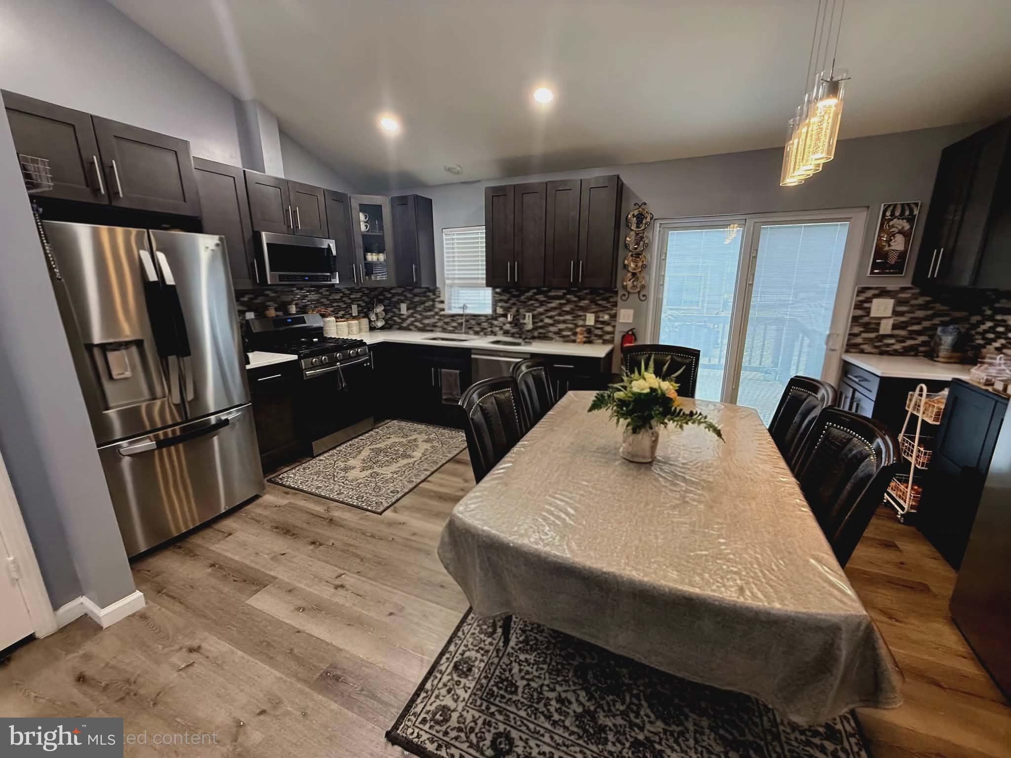 9 Brafferton Way Rosedale, MD 21237 - Photo 12 of 26 a kitchen with stainless steel appliances granite countertop a sink refrigerator and microwave