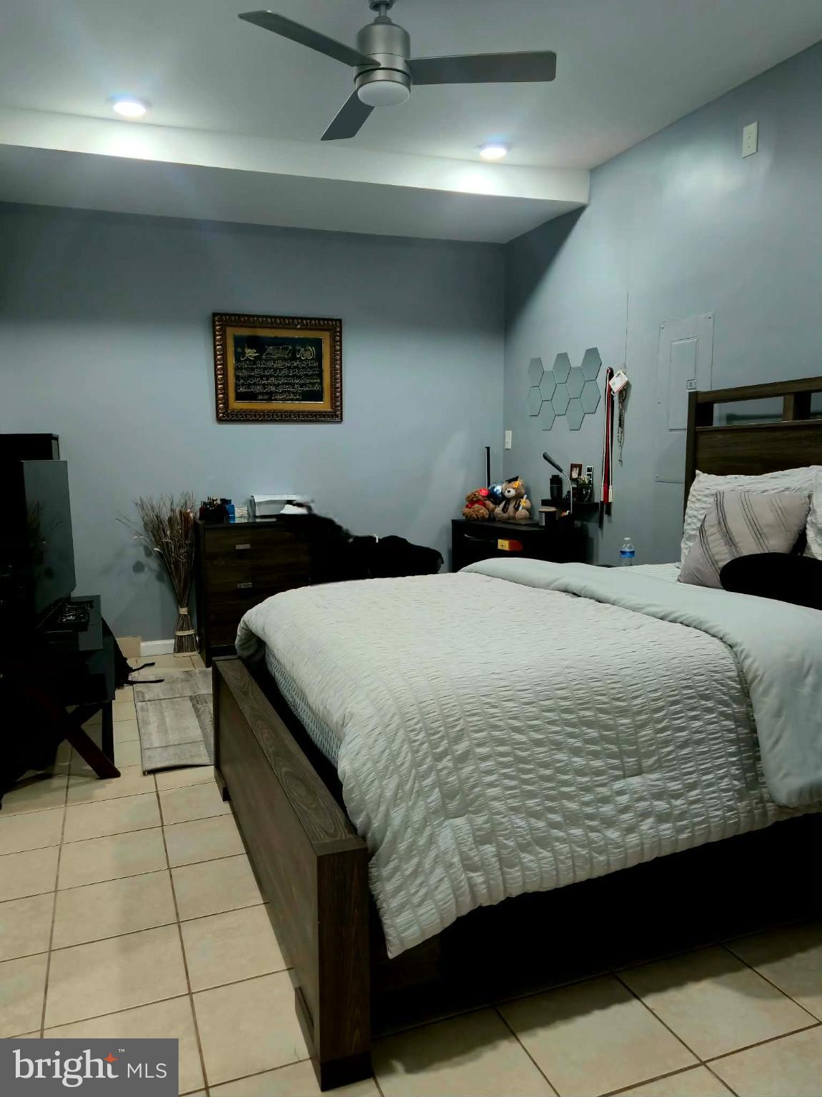 9 Brafferton Way Rosedale, MD 21237 - Photo 19 of 26 a bedroom with a large bed and a lamp on dresser