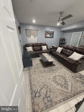 a living room with a couch and a stove