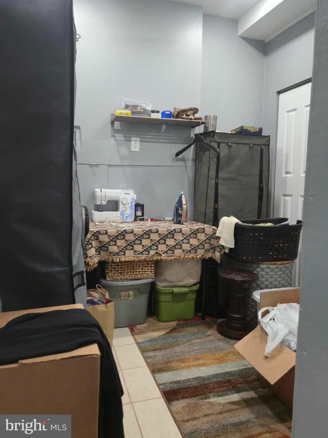 9 Brafferton Way Rosedale, MD 21237 - Photo 24 of 26 a living room with a couch and a stove