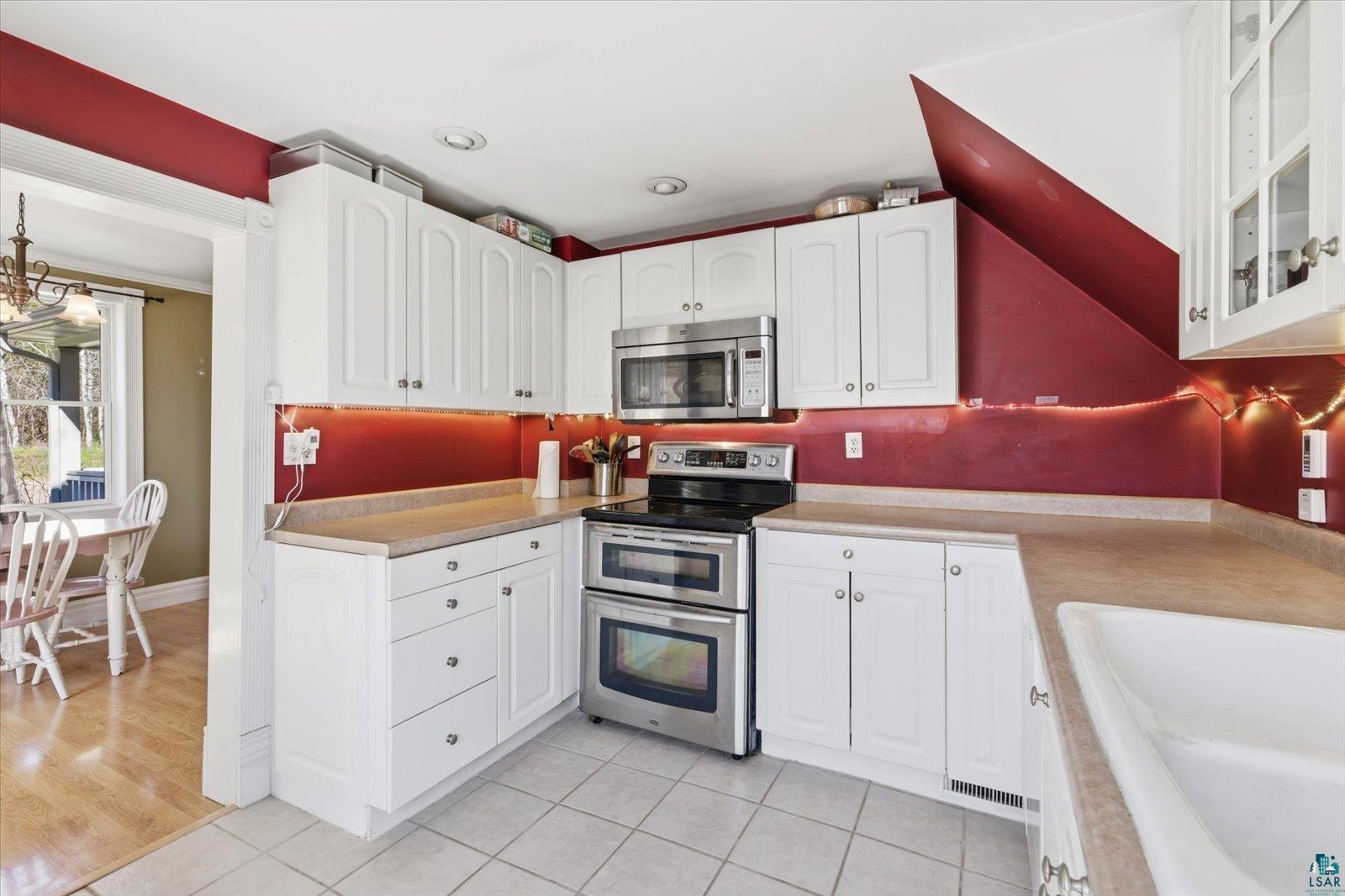 50 Main Street Soudan, MN 55782 - Photo 2 of 31 White cabinetry and light countertops define this kitchen space