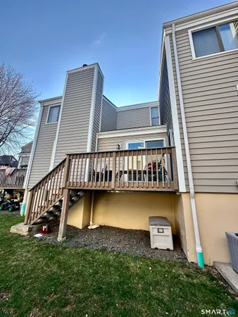 a wooden deck with a yard