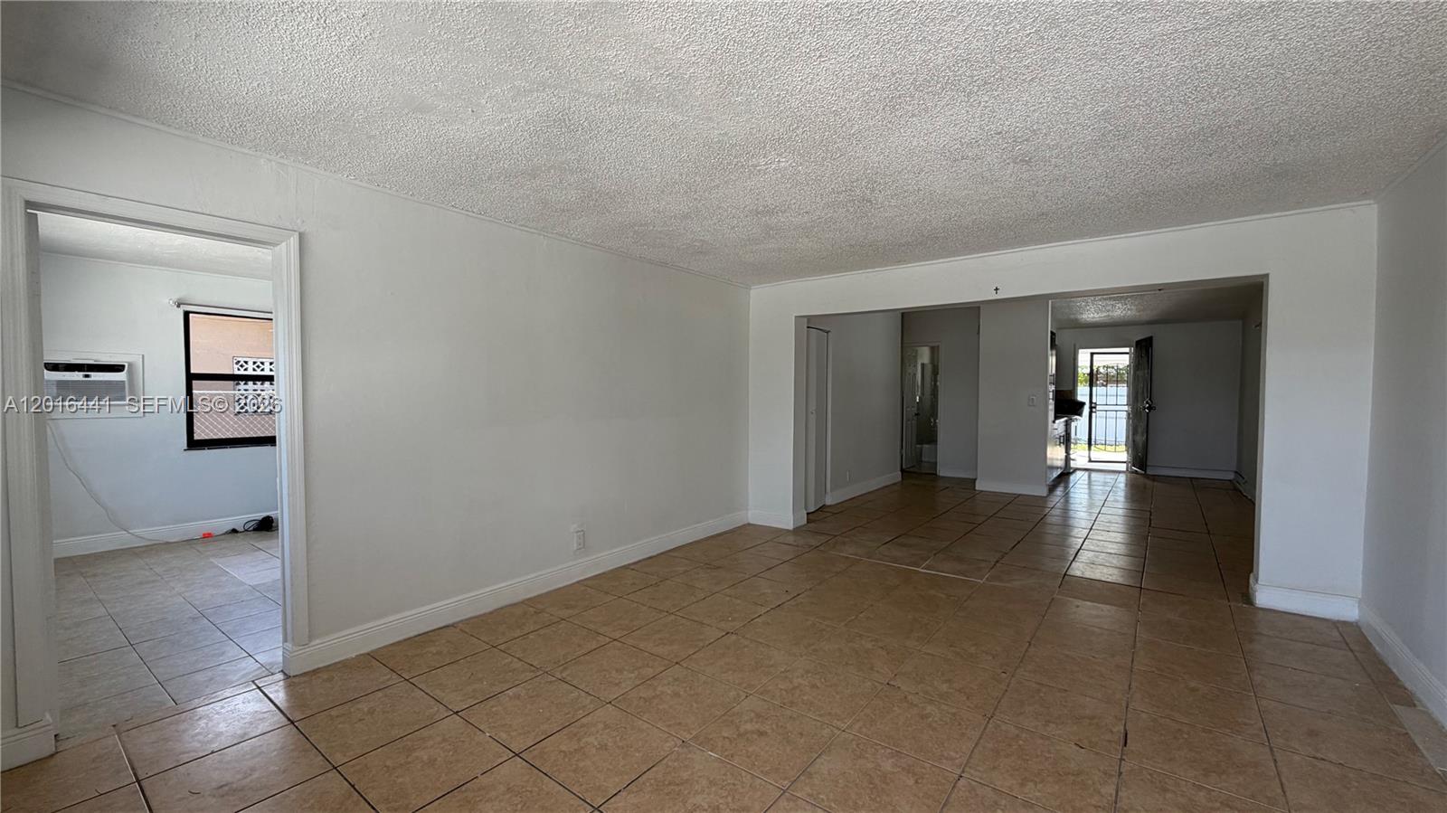 2230 Service Road Opa-Locka, FL 33054 - Photo 4 of 25 a view of empty room with wooden floor