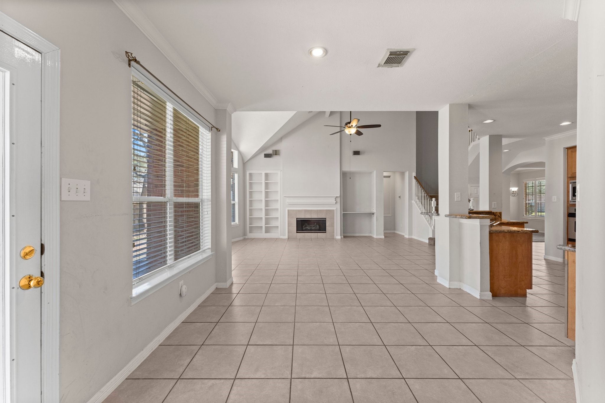 25814 Clear Springs Way Spring, TX 77373 - Photo 19 of 48 a view of a kitchen with a sink and a fireplace