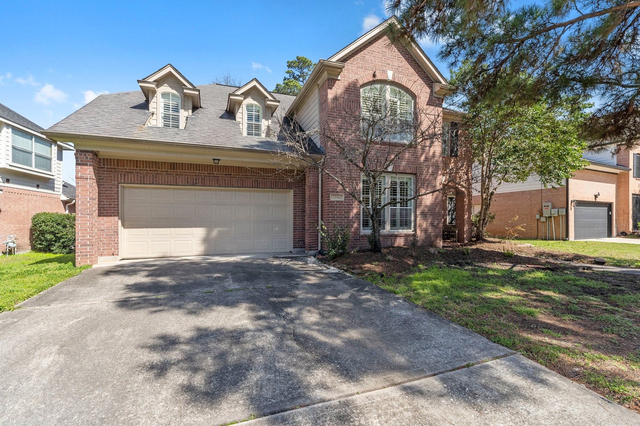 25814 Clear Springs Way Spring, TX 77373 - Photo 2 of 48 a front view of a house with garden
