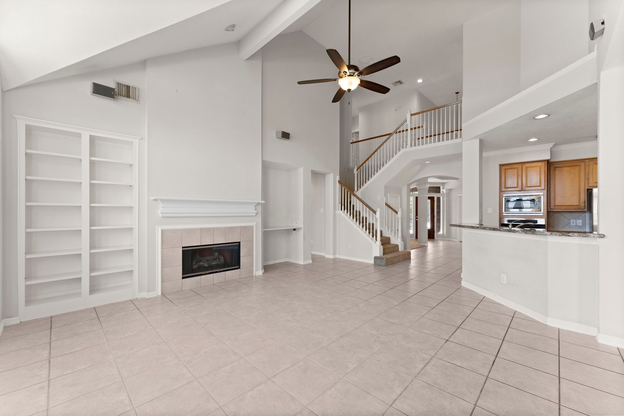 25814 Clear Springs Way Spring, TX 77373 - Photo 23 of 48 a view of a livingroom with an empty space and a fireplace