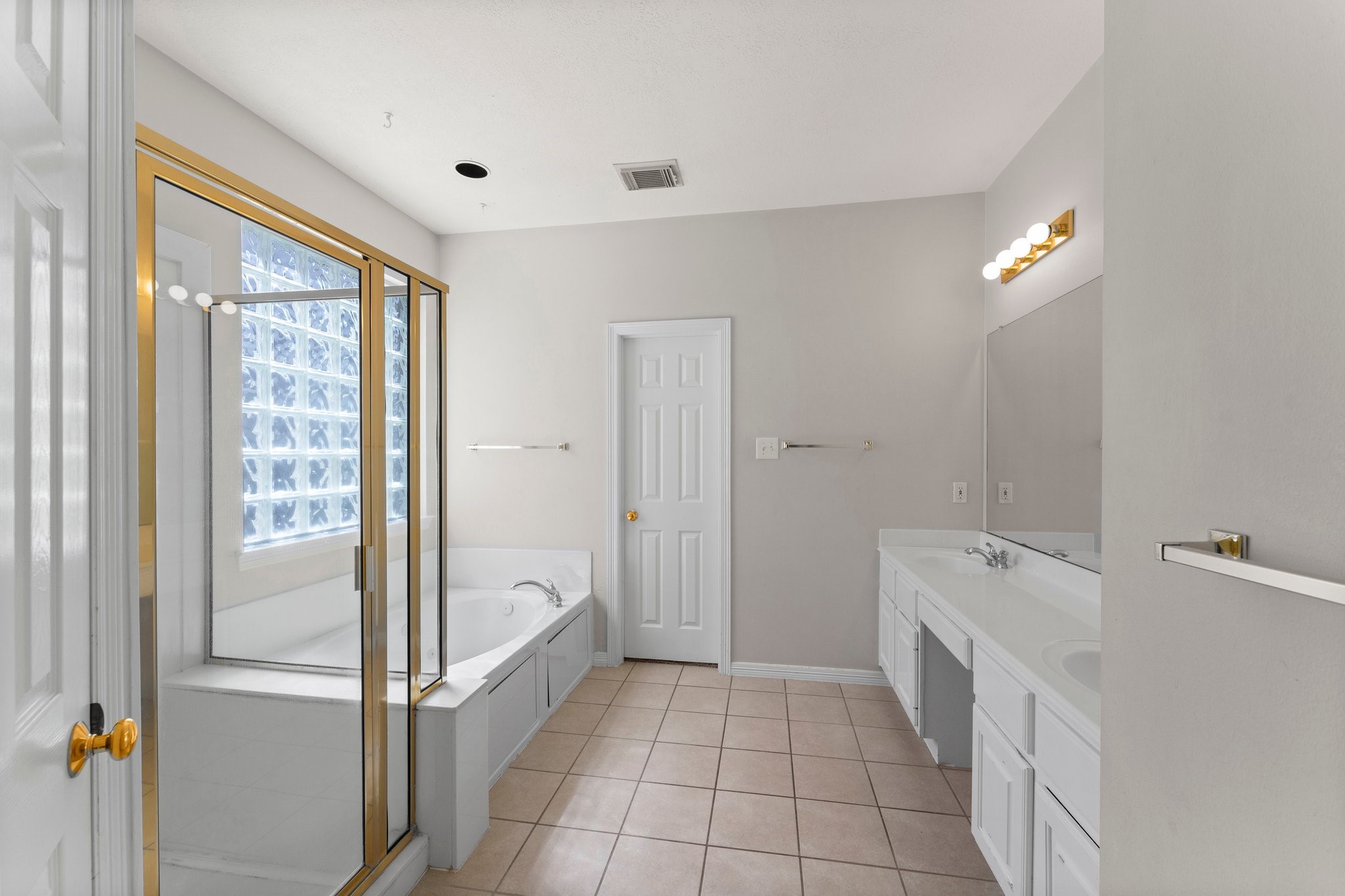 25814 Clear Springs Way Spring, TX 77373 - Photo 30 of 48 a bathroom with a tub sink and mirror