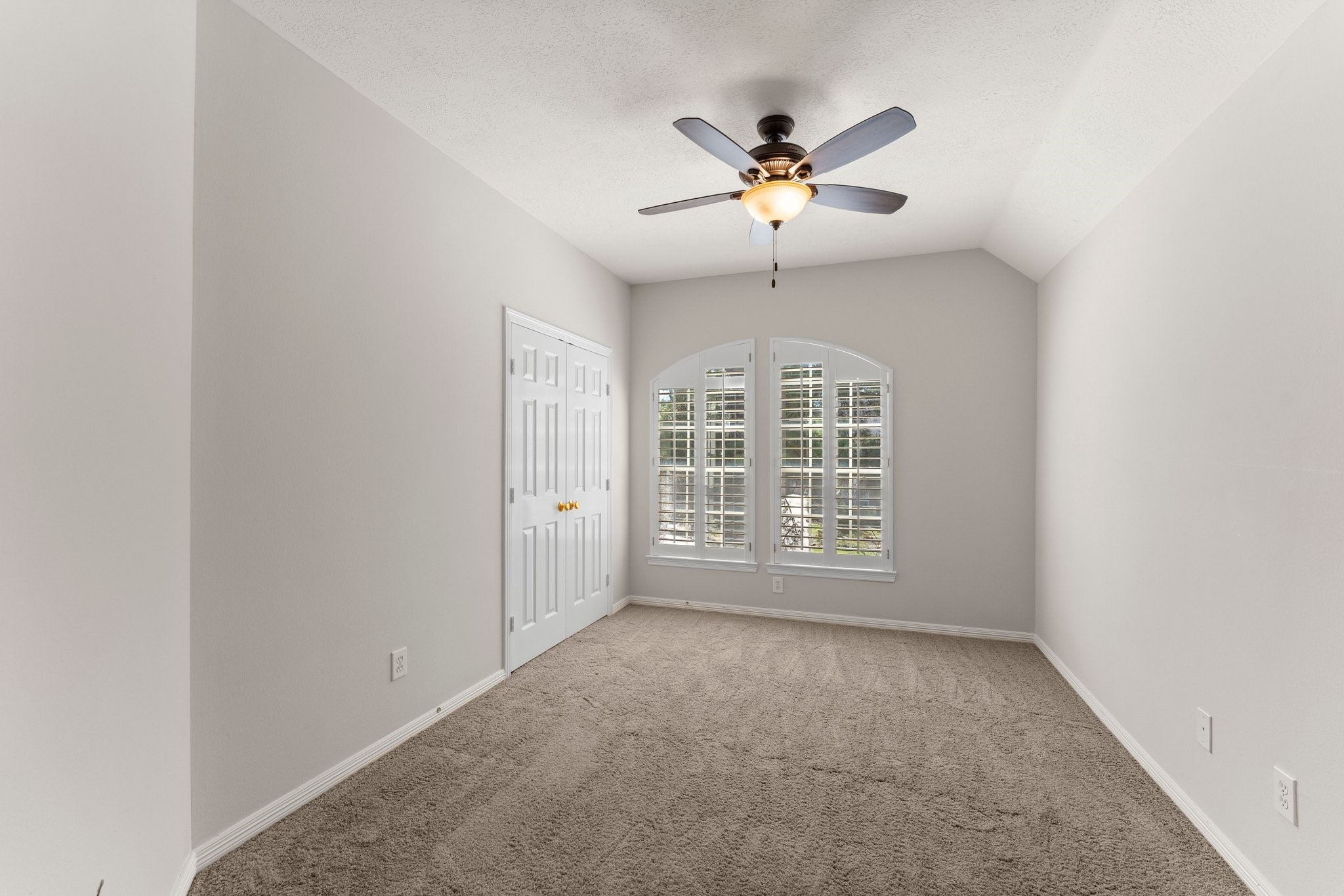25814 Clear Springs Way Spring, TX 77373 - Photo 41 of 48 an empty room with chandelier fan and windows