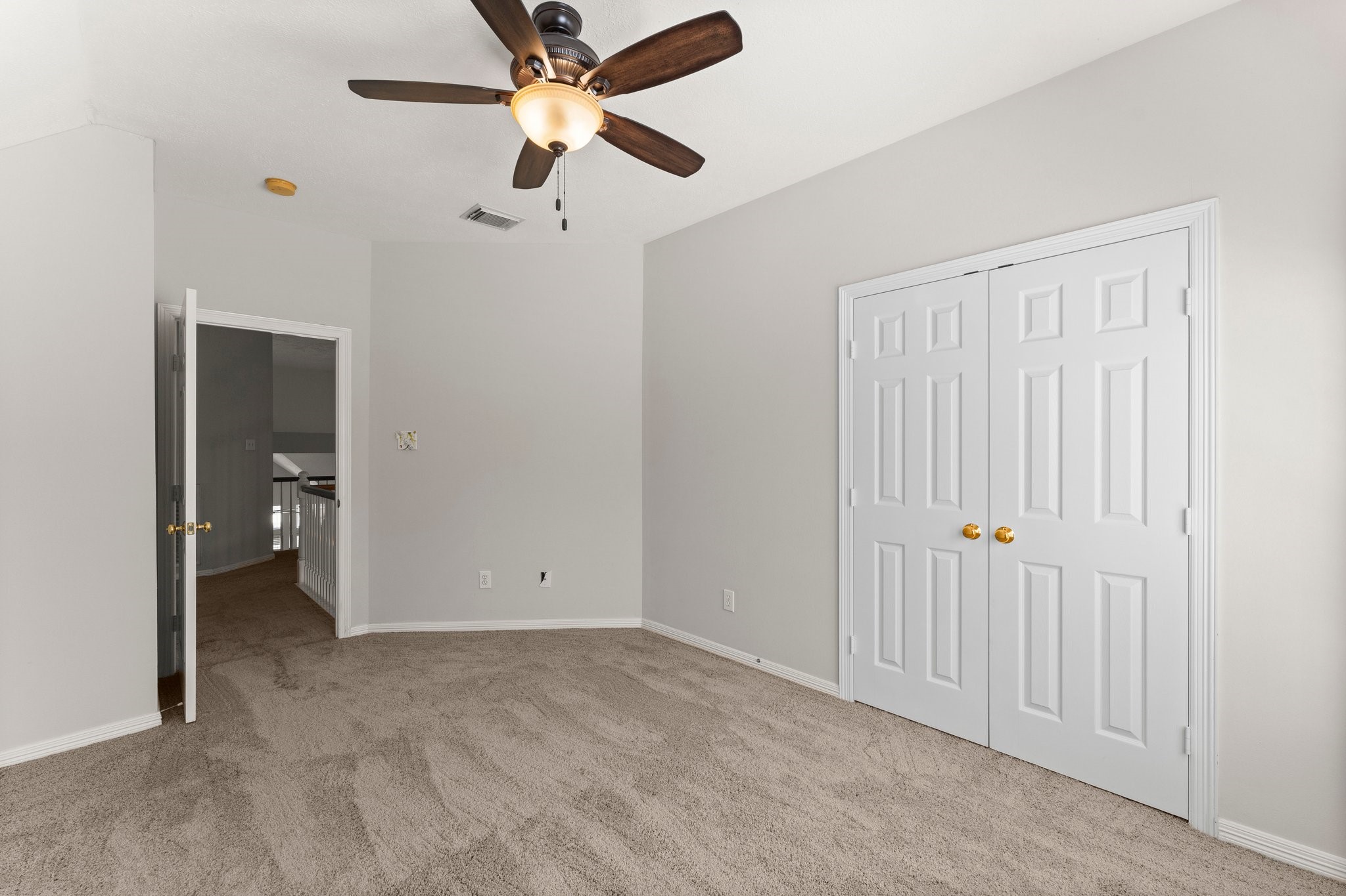 25814 Clear Springs Way Spring, TX 77373 - Photo 42 of 48 an empty room with closet and a chandelier fan