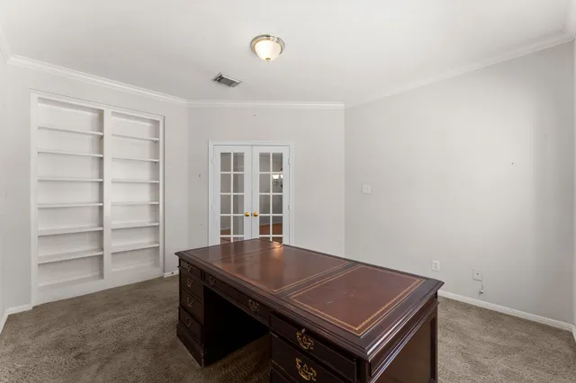 a view of a kitchen with a sink and a refrigerator