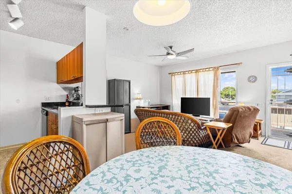 a kitchen with stainless steel appliances granite countertop a sink a stove and a microwave oven