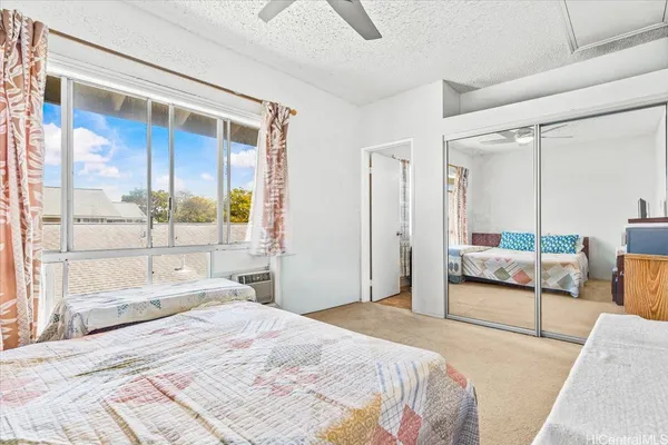 a white toilet sitting next to a bath tub