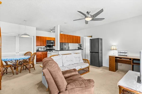 a kitchen with a table chairs sink and cabinets