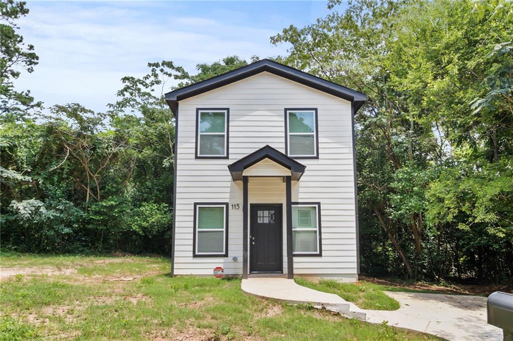 1912 Kitchens Road Macon, GA 31211 - Photo 1 of 20 a front view of a house with garden