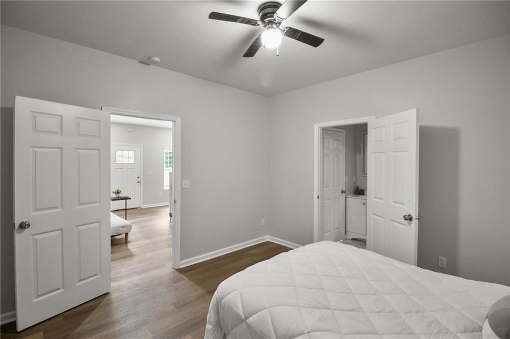 1912 Kitchens Road Macon, GA 31211 - Photo 12 of 20 a bedroom with a bed and a chandelier