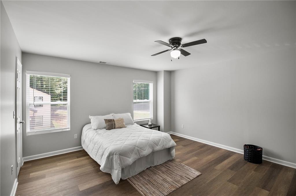 1912 Kitchens Road Macon, GA 31211 - Photo 17 of 20 a bedroom with a bed and wooden floor