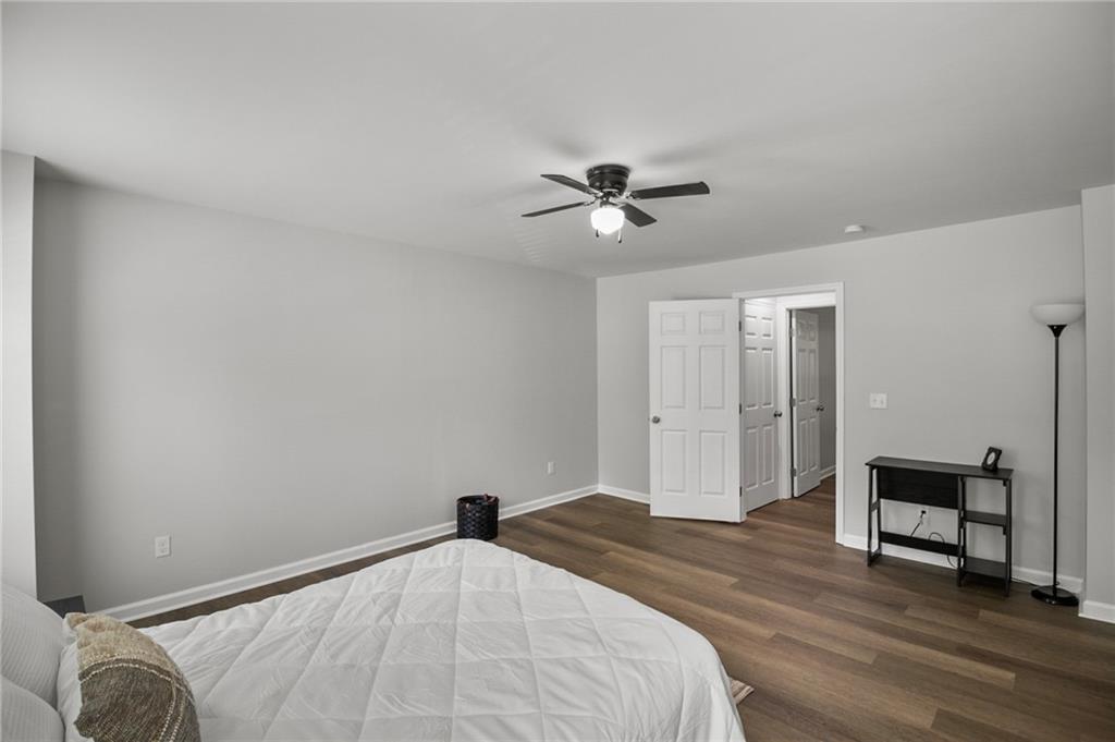 1912 Kitchens Road Macon, GA 31211 - Photo 18 of 20 a bedroom with a bed and a chandelier