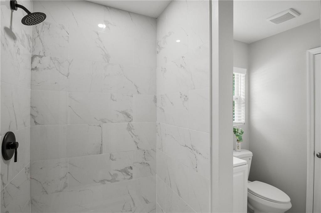 1912 Kitchens Road Macon, GA 31211 - Photo 19 of 20 a bathroom with a toilet and shower