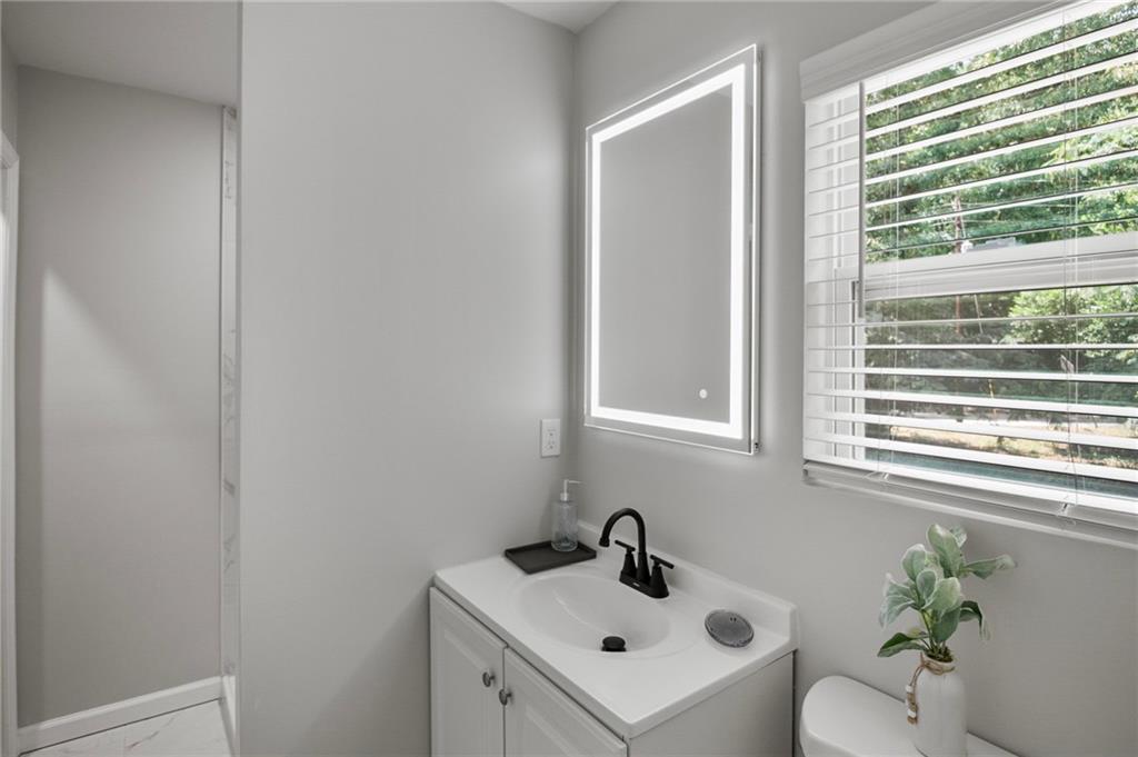 1912 Kitchens Road Macon, GA 31211 - Photo 20 of 20 a white sink sitting next to a white sink