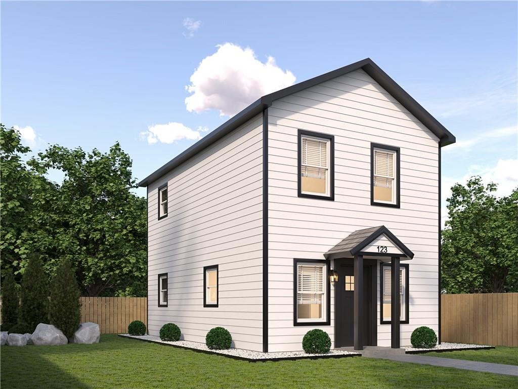 1912 Kitchens Road Macon, GA 31211 - Photo 2 of 20 a front view of a house with a yard