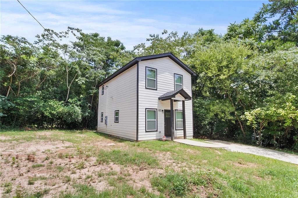 1912 Kitchens Road Macon, GA 31211 - Photo 4 of 20 front view of a house with a yard